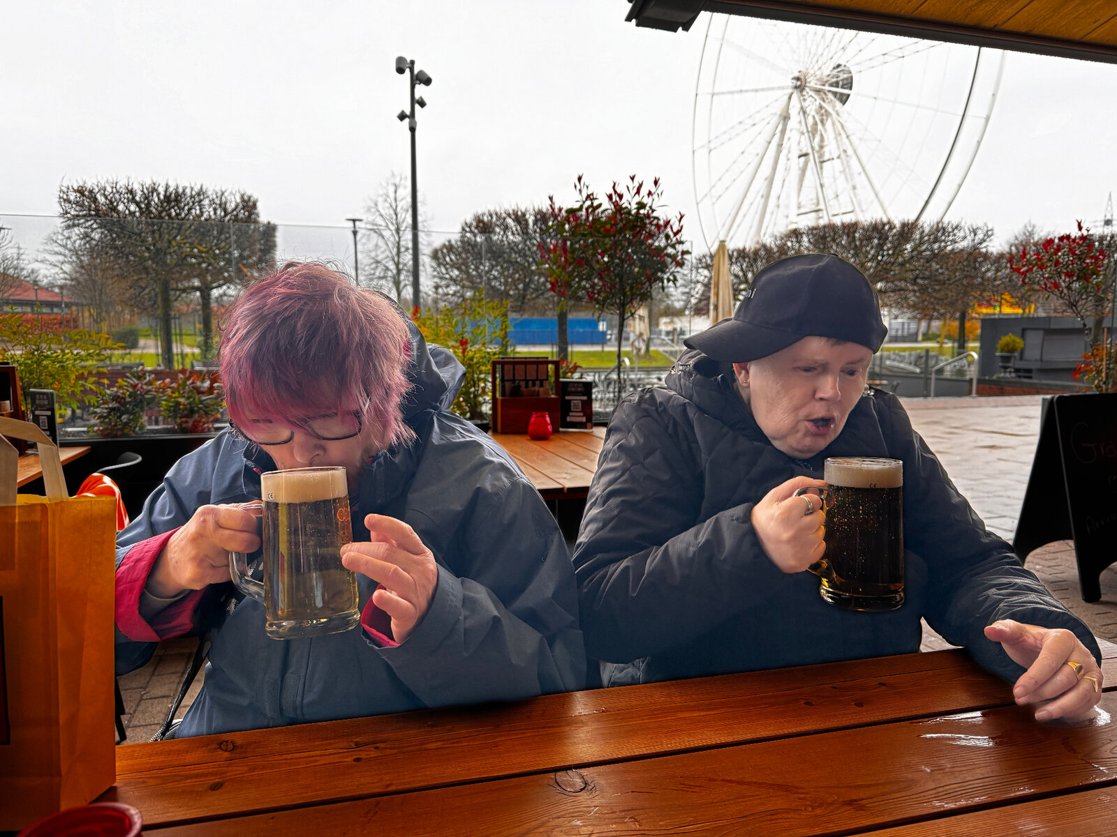 Residents enjoying hot drinks together on an outing