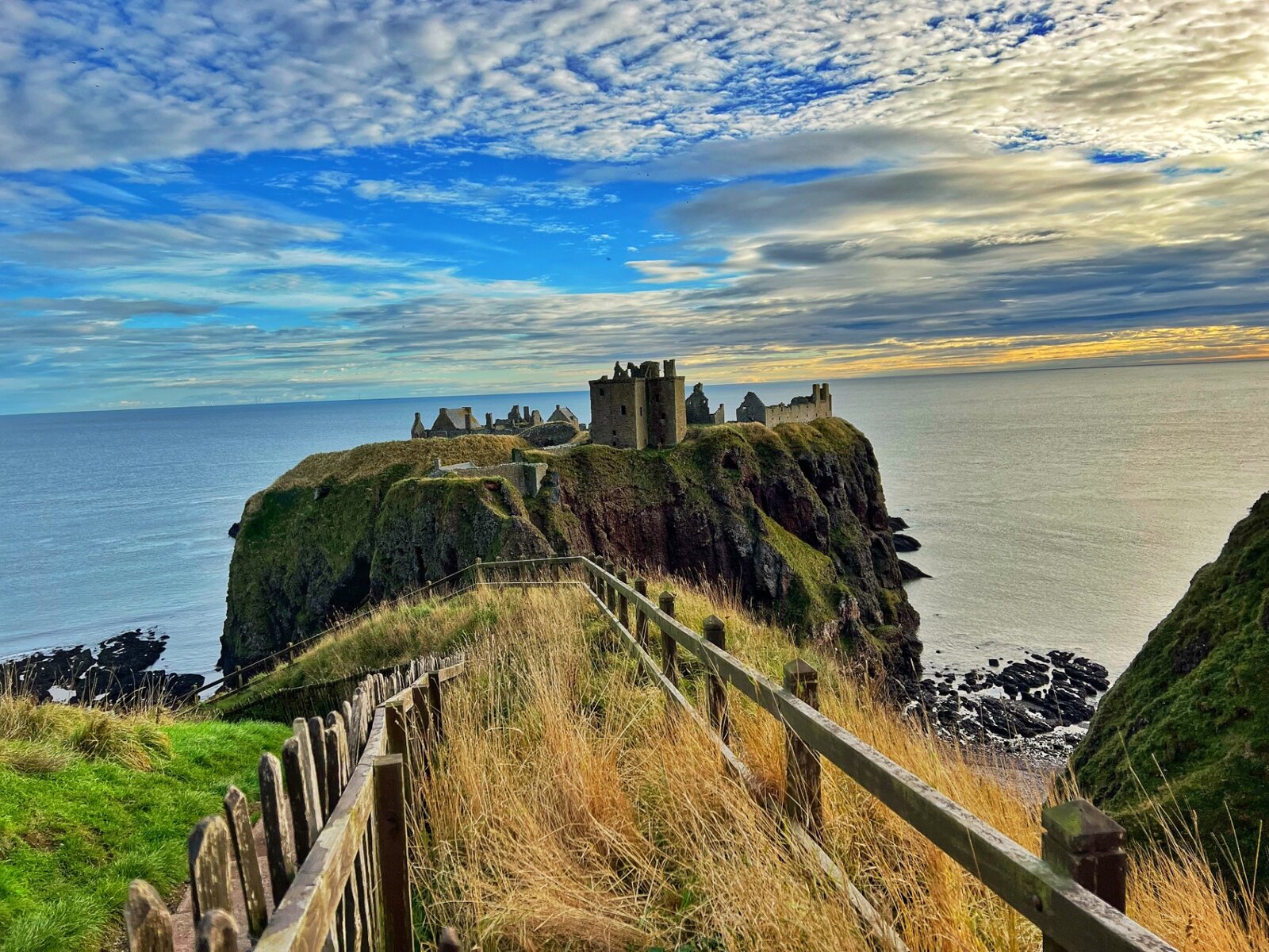 Scenic coastal castle ruins visited on an adventure