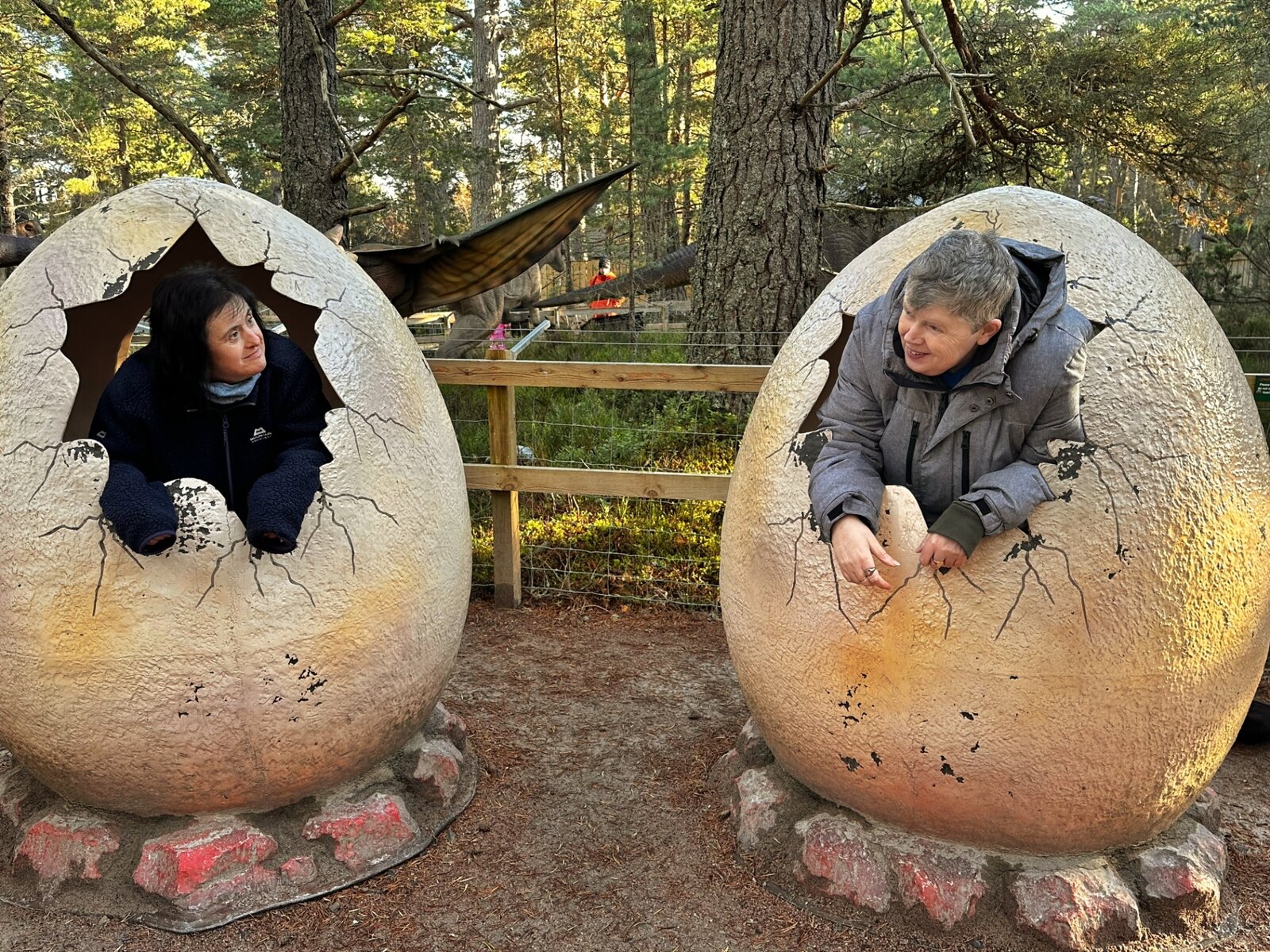 Residents having fun in dinosaur egg sculptures