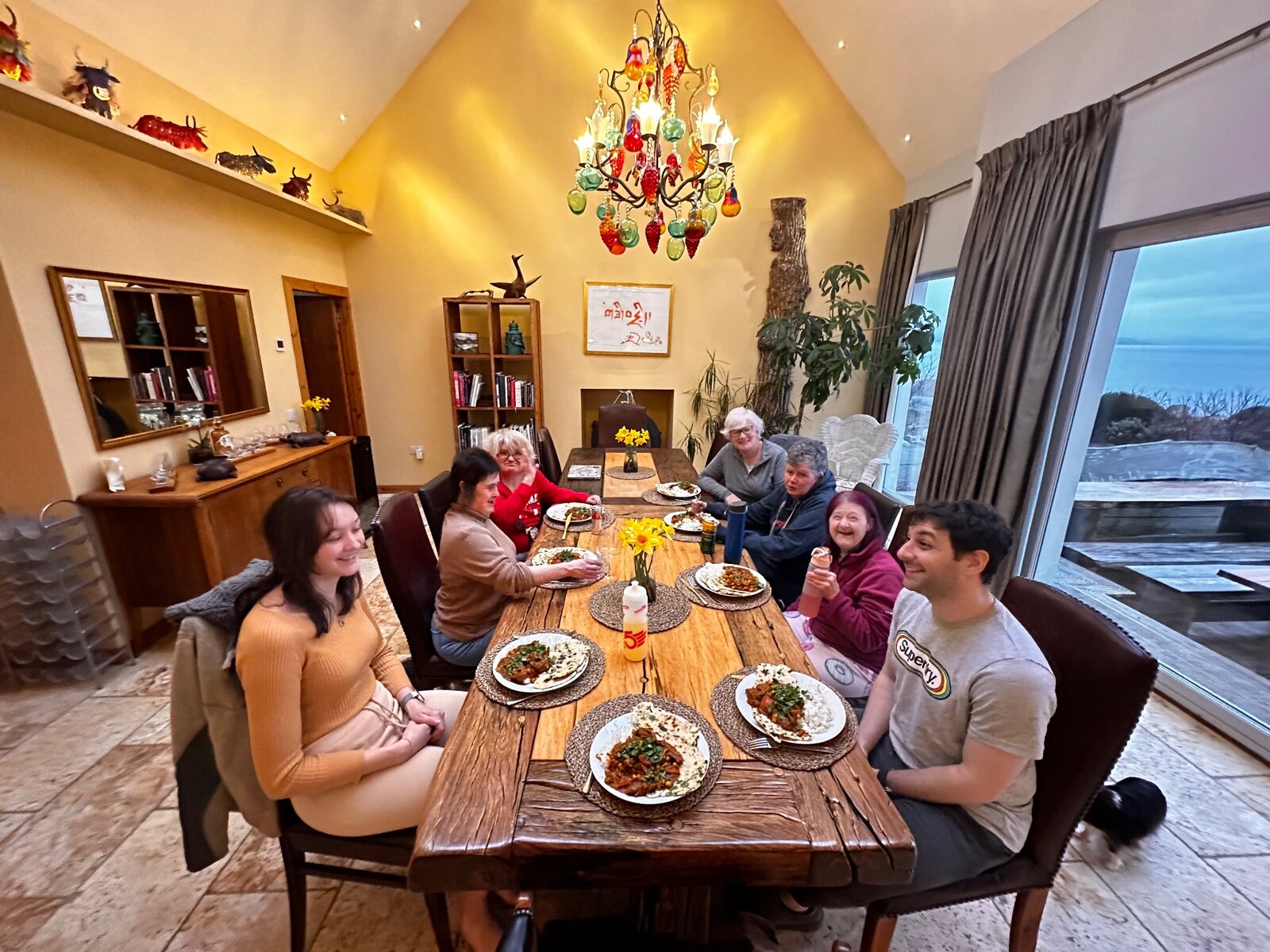 Residents and staff sharing a meal together on holiday