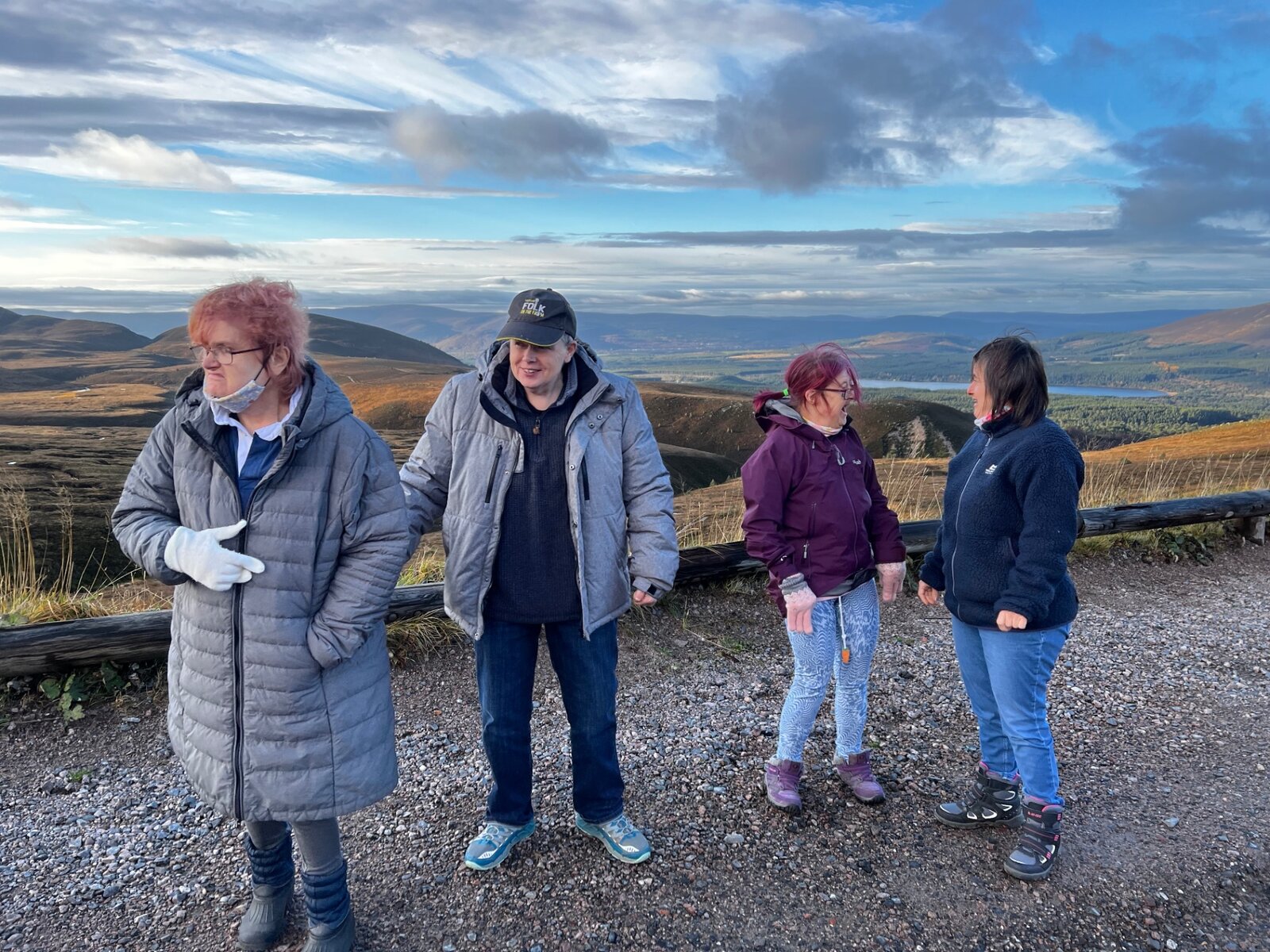 Residents and staff taking in mountain views in the Cairngorms