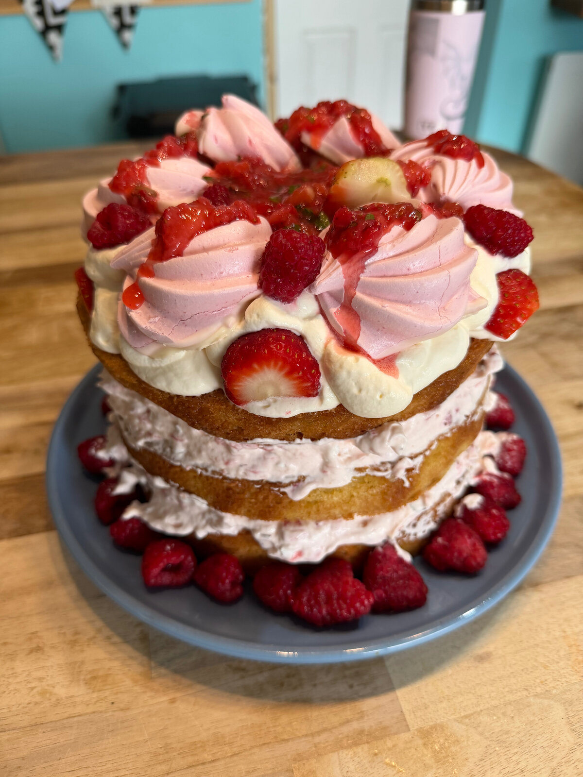 Strawberry and raspberry layered birthday cake