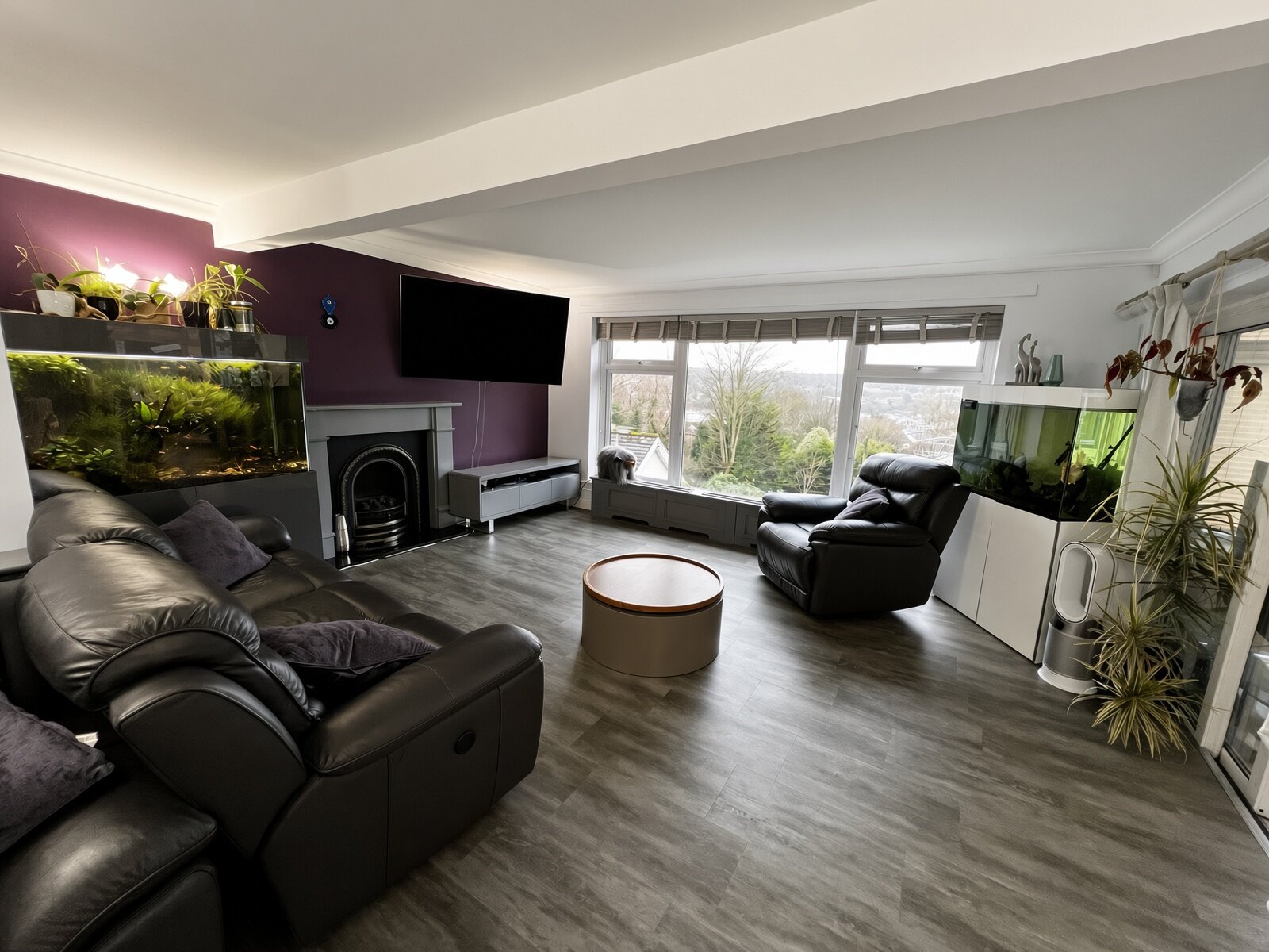 The shared lounge at Hyland Residential Home, with comfortable armchairs and natural light